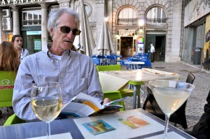 Dad enjoying wine with his guidebooks