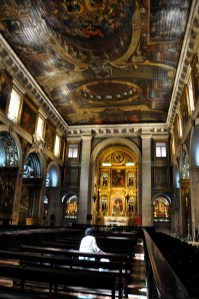 Woman standing into a shaft of light. Divine blessing?